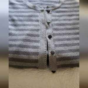 Grey long sleeved cardigan.